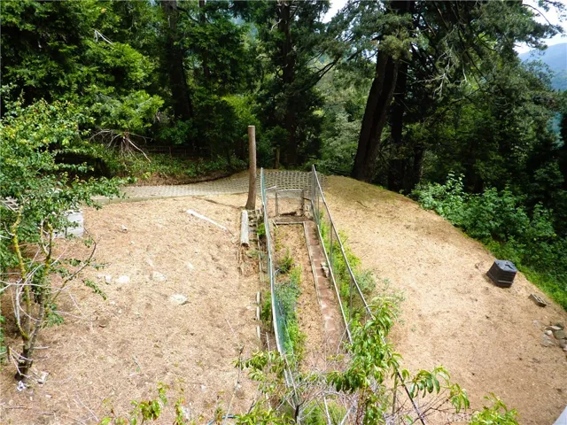 Looking down the deck, you can see the garden area that is fenced in.
