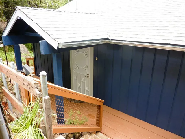 Just a few steps down from the covered parking area is the front door.
