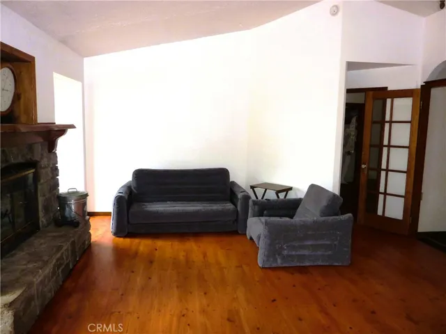 Hardwood flooring and plenty of room for relaxing in the living room.