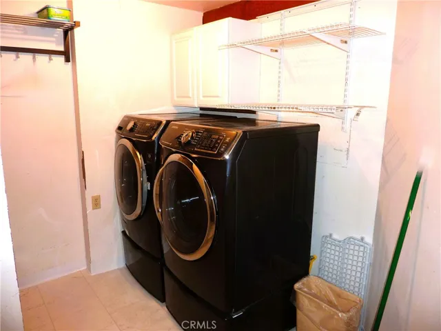 Theer's a separate room for the washer and dryer on the lower level of the home.