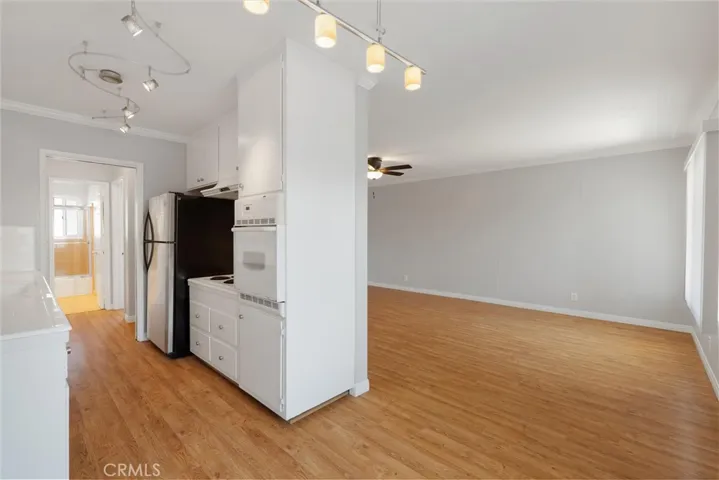 View from the dining area facing the kitchen and living area