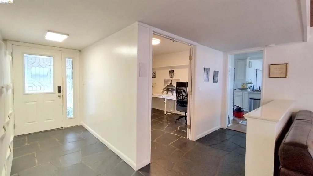 Entrance foyer featuring baseboards