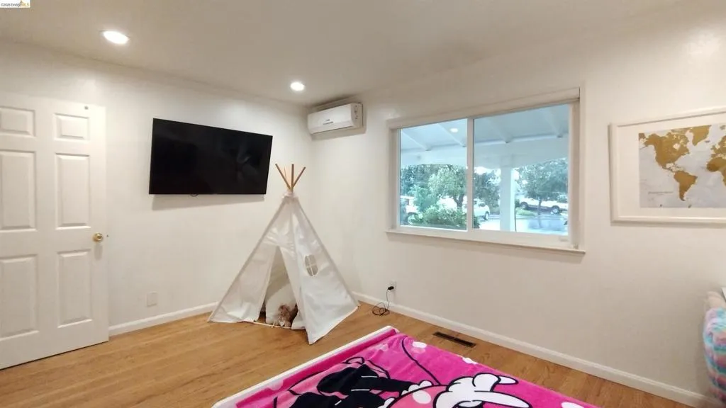 Rec room featuring light wood finished floors and recessed lighting