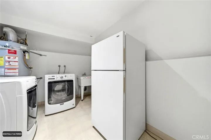 Laundry Room In The Garage Area.