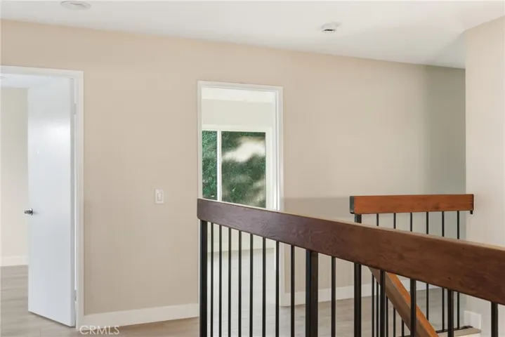 View of Stairs and Second Bedrooms from Primary Bedroom. (3 second bedrooms total).