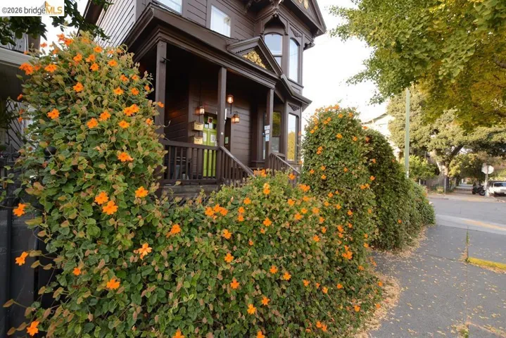 View of property exterior featuring covered porch
