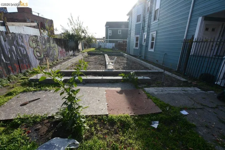 Fenced backyard with a vegetable garden