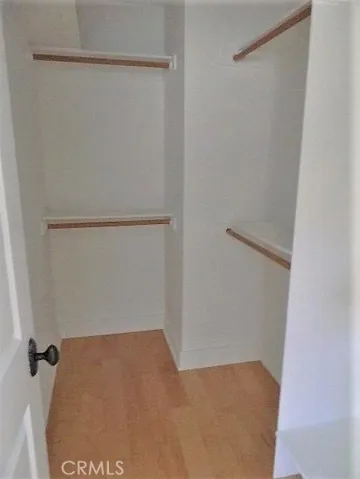 Walk-in closet in primary bedroom