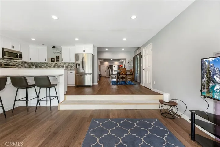 Family room view to kitchen, dining and living rooms
