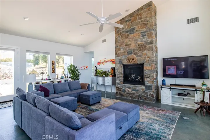 Stone fireplace in the vaulted main living area