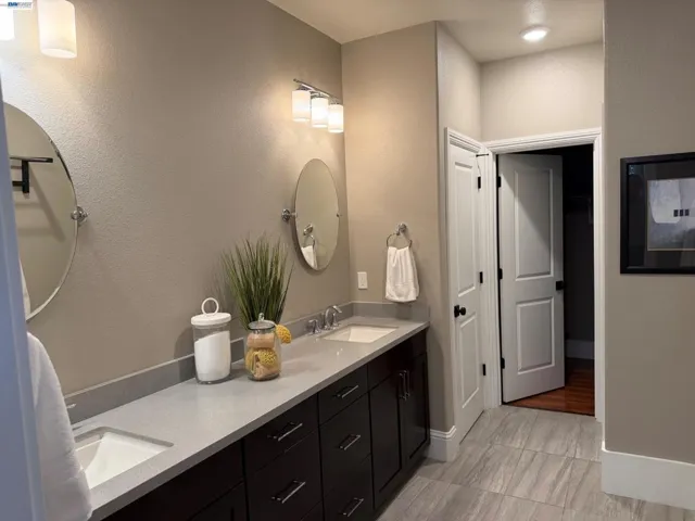 Primary Bathroom with linen closet and walk-in closet.
