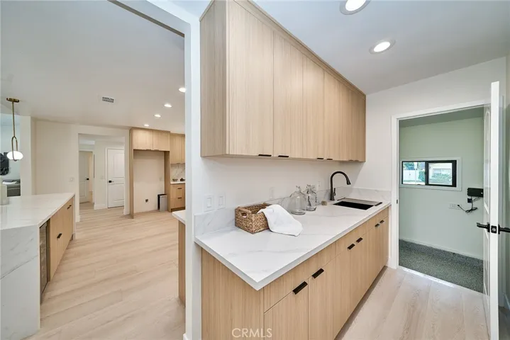 SPACIOUS LAUNDRY AND STORAGE AREA