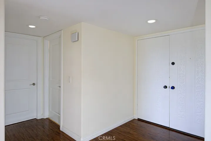 The double door entry opens to a large entry hall leading to the bedroom and bathroom.