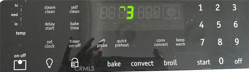 The oven offers convection and steam cleaning options.