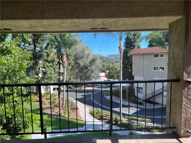 View from the patio of pretty trees and at night you'll see some twinkling lights from the hills of Aliso Viejo.