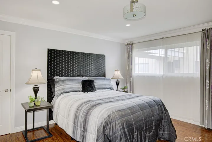The Bedroom is large enough to accommodate large pieces of furniture.  The smooth ceilings, crown molding and recessed lighting give a luxurious feeling to the room.  There's also a ceiling mounted light fixture that would be a perfect place to switch to a ceiling fan for economical cooling in the summer.