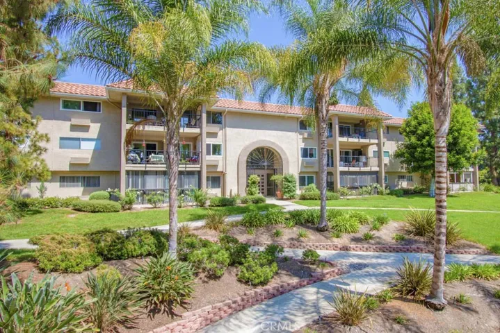 Pretty greenbelt surrounds the building - maintained by the HOA