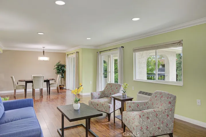 Looking from the living room toward the dining room you'll appreciate the two sliding glass doors that lead to the covered patio.