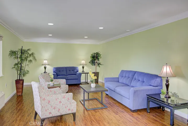 This massive living room holds lots of furniture.  Many owners set up a room divider or screen to separate the far end o the room  and use it as an office or for a guest bed.