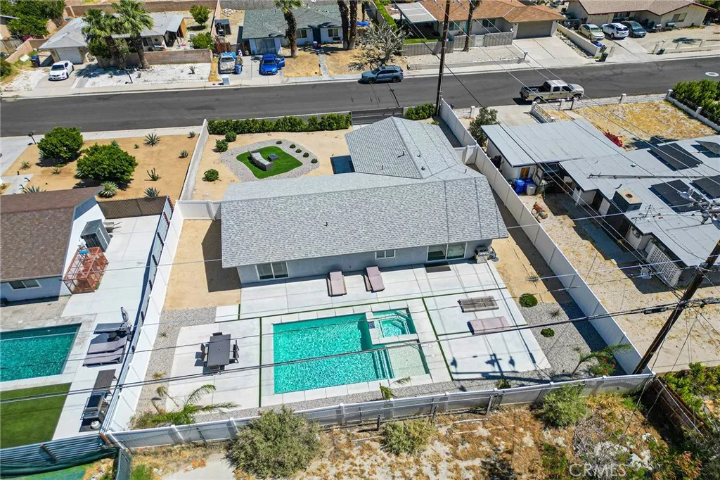 Aerial view looking over the backyard with pool.