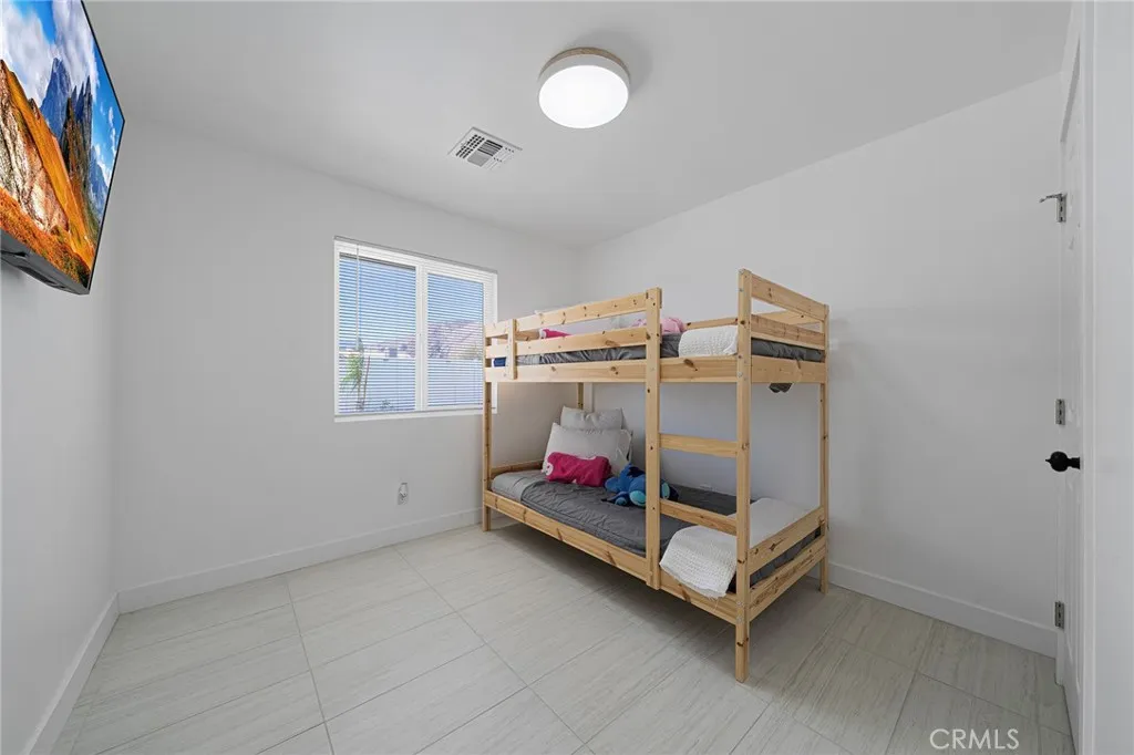 This bedroom is located right before entering into the living room. Double pane window has a view of the backyard.