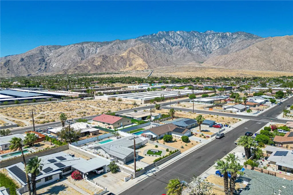 Home in the bottom middle portion of the image showing the beautiful hills.