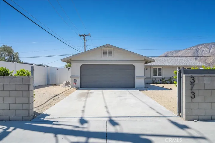 Sliding gate opens up to the driveway.