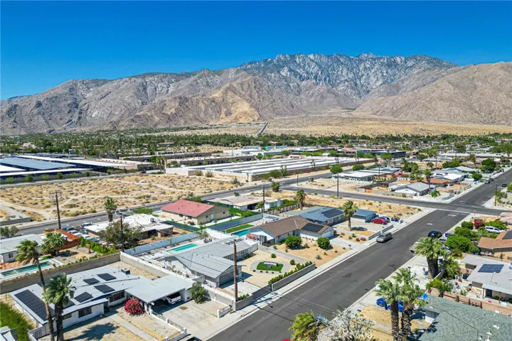 Home in the bottom middle portion of the image showing the beautiful hills.