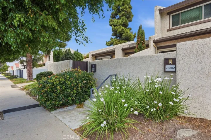 Updated end unit townhome in Torrance 90502 with private entry courtyard and attached garage access