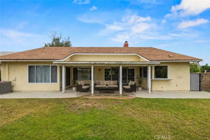 large back yard with covered patio- staged patio