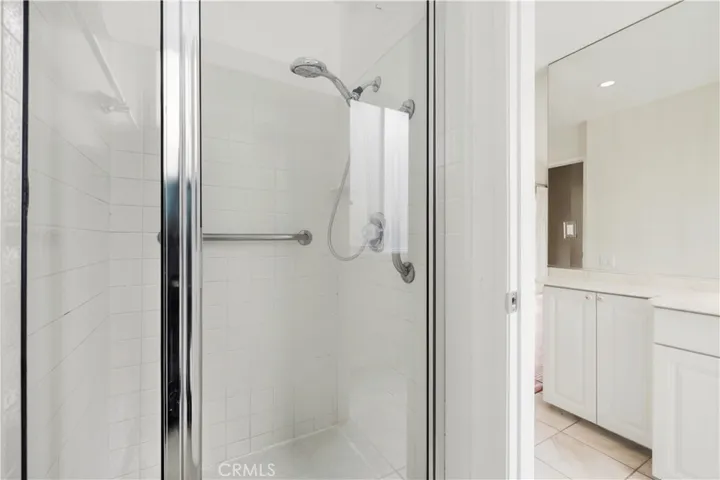 shower room separate from vanity area in primary bath