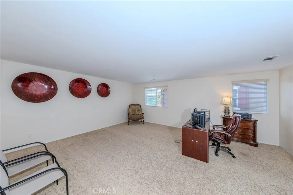 Upstairs loft being used as office space, can be 2nd family room, media room, workout space, tons of possibilities