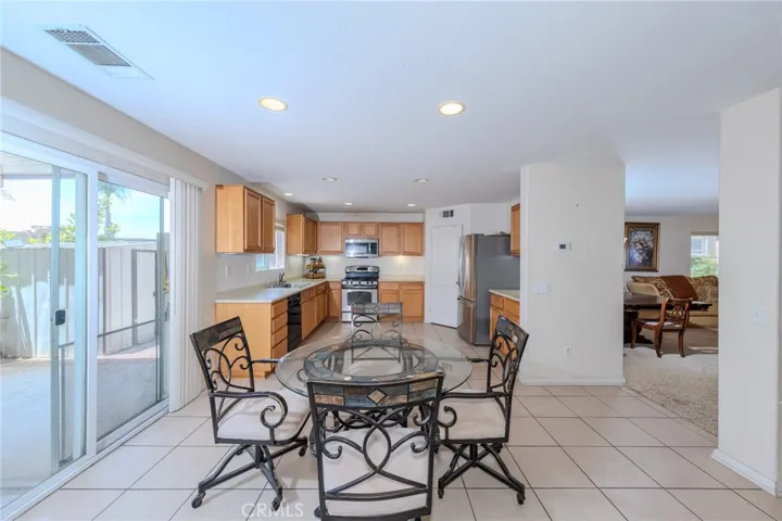 Seprate eating area between kitchen and family room. Plenty of space if an island is desired.