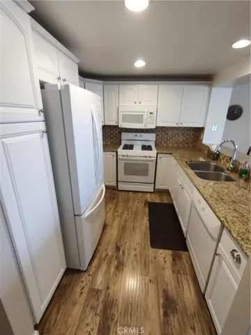 Kitchen with granite countertops and abundance of storage