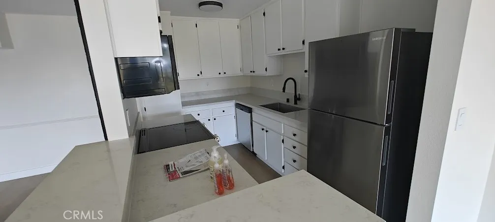 Kitchen. All lights off, outdoor ambient light only