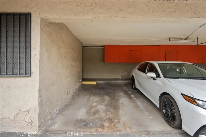 Carport area with two assigned storage cabinets