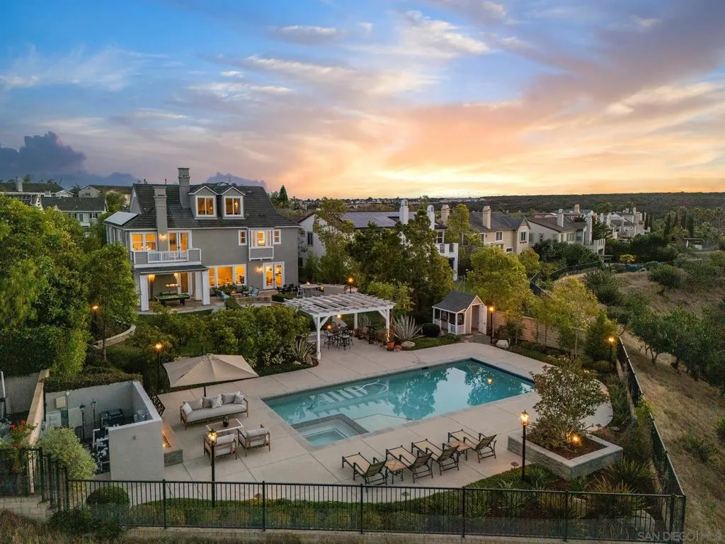 The pool and decking with amazing fire feature,  the grassy areas the " kids amphitheater" with seat walls the built in bbq bar, covered areas and even a kids play house!