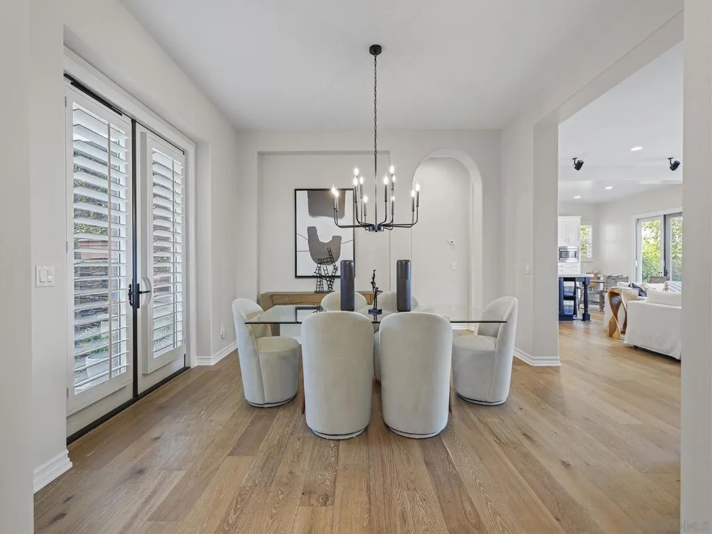 Spacious dining room that opens to great room and front courtyard, as well as entry foyer.