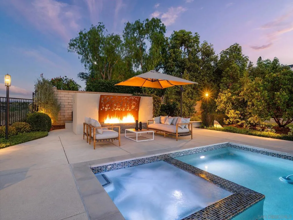 Amazing sitting areas, and cool fire feature. Even an outdoor shower behind the wall.