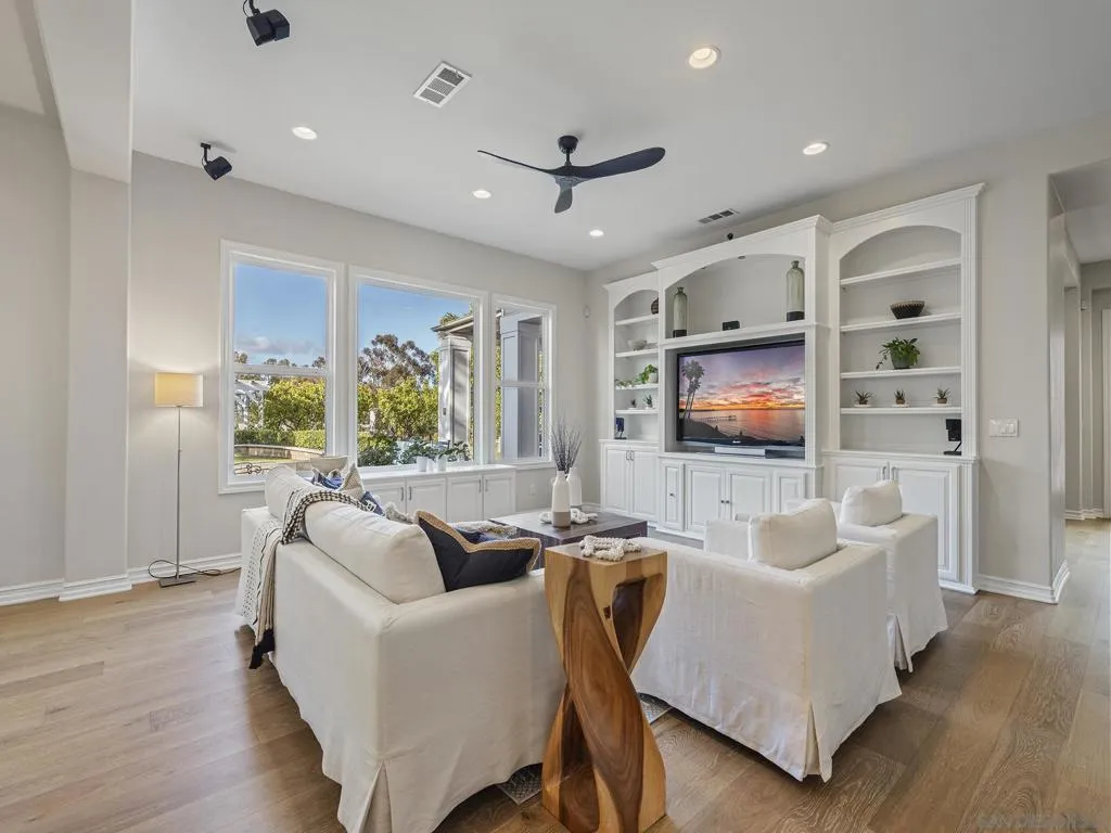 nice bright family room with custom built in.