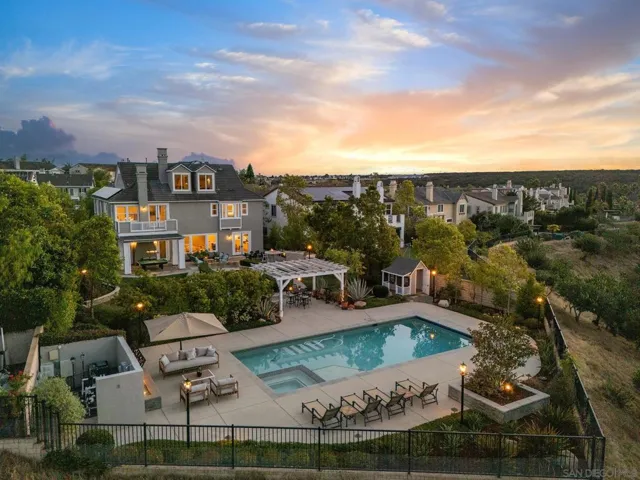 The pool and decking with amazing fire feature,  the grassy areas the " kids amphitheater" with seat walls the built in bbq bar, covered areas and even a kids play house!
