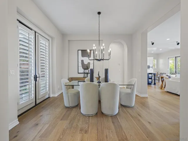 Spacious dining room that opens to great room and front courtyard, as well as entry foyer.