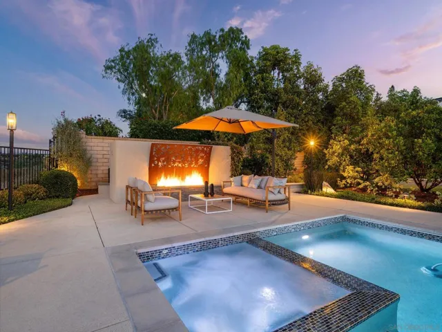 Amazing sitting areas, and cool fire feature. Even an outdoor shower behind the wall.