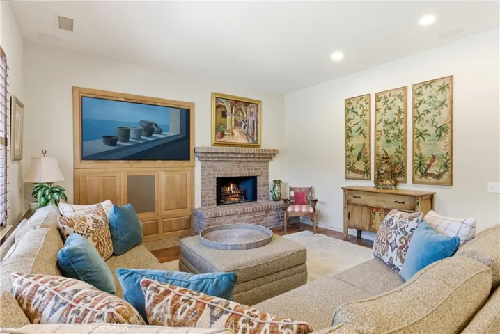 Designed for everyday living and entertaining, this spacious gathering room offers comfortable seating areas and a warm, welcoming ambiance.