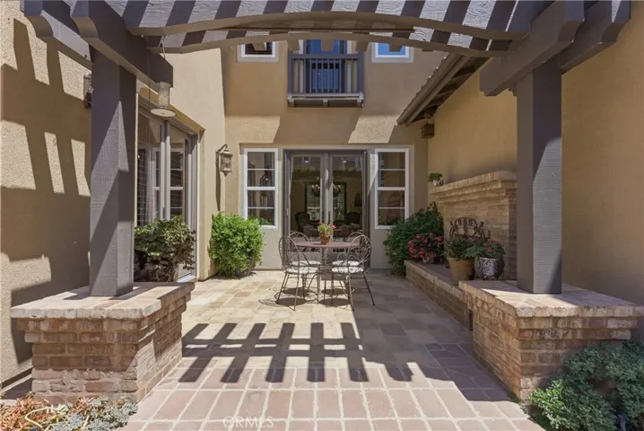 The central courtyard serves as the heart of the home, offering an inviting space for outdoor dining, entertaining, and relaxation.