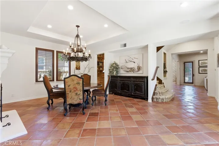 Perfect for entertaining, the spacious dining room flows seamlessly into the home's living spaces while offering views of the private courtyard.
