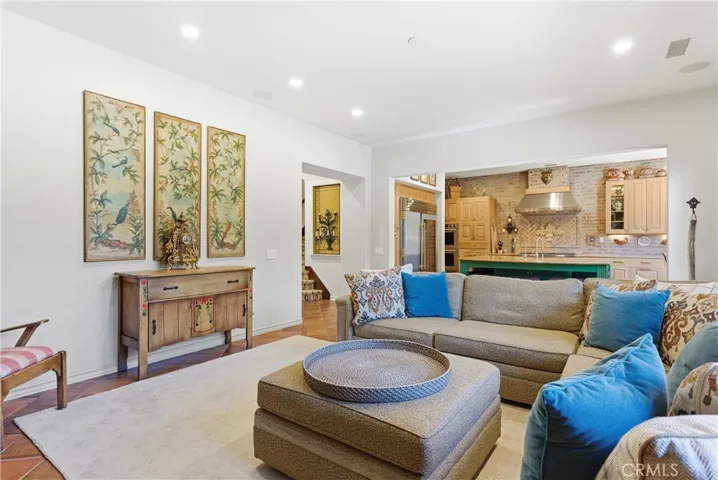 The open-concept family room flows effortlessly into the kitchen, creating a seamless space for entertaining and everyday living.