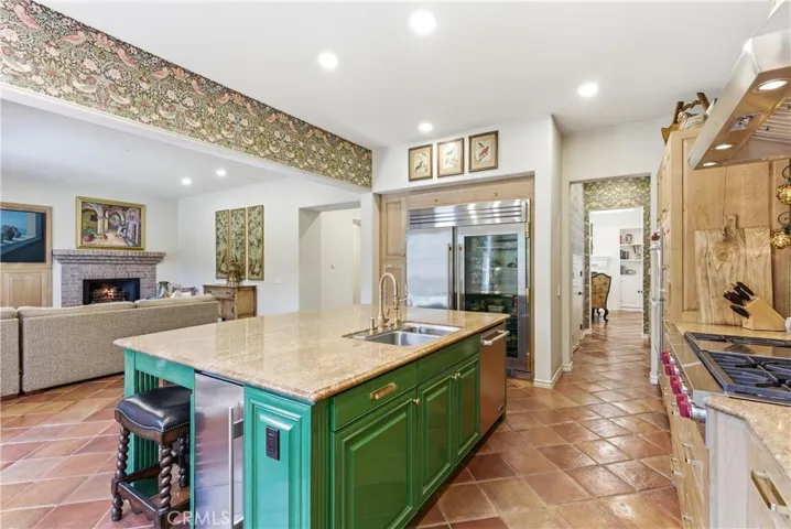 Open sightlines between the kitchen and family room enhance the home's connected floor plan and effortless indoor living experience.