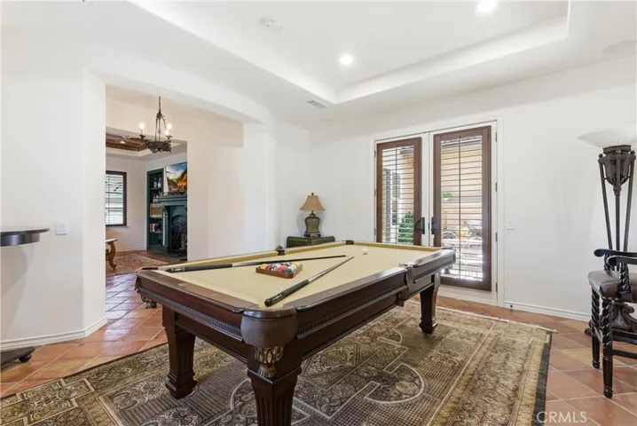 Spacious and inviting, this flexible living area showcases classic finishes and seamless access to adjacent gathering spaces.