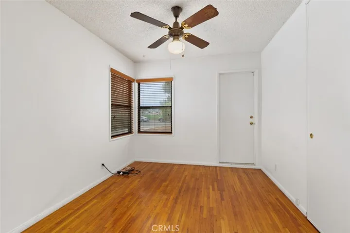 Front-facing bedroom with neighborhood views